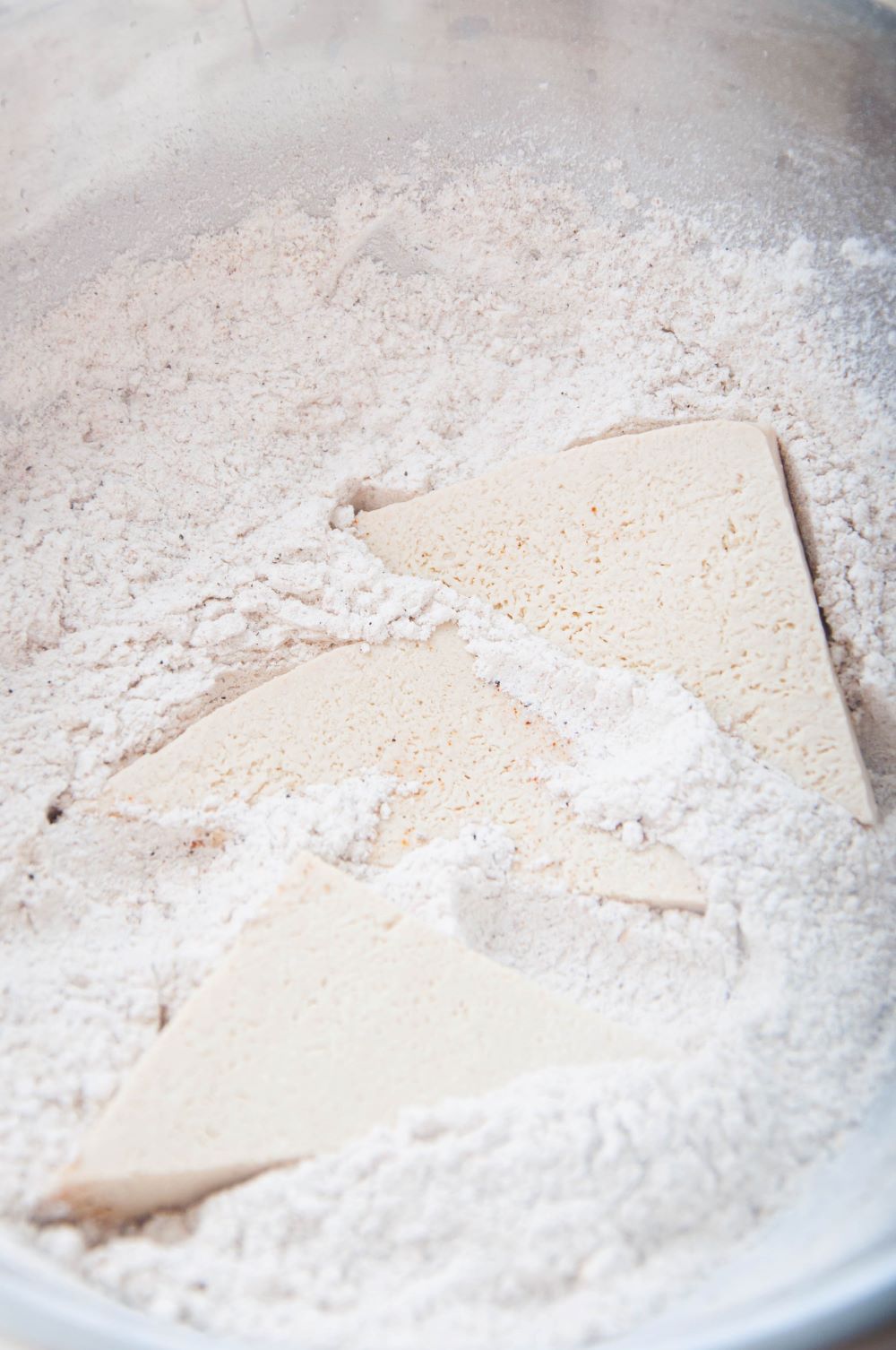 Tossing the tofu into the flour mixture