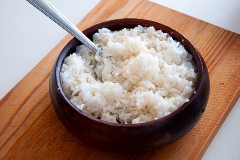 Mixing rice with mirin and salt and pepper
