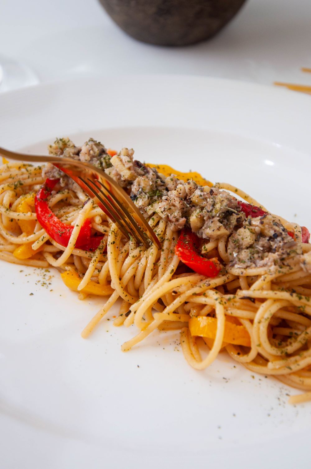 Presentation of Vermicelli with Bell Peppers, Ginger, and Anchovy Dressing