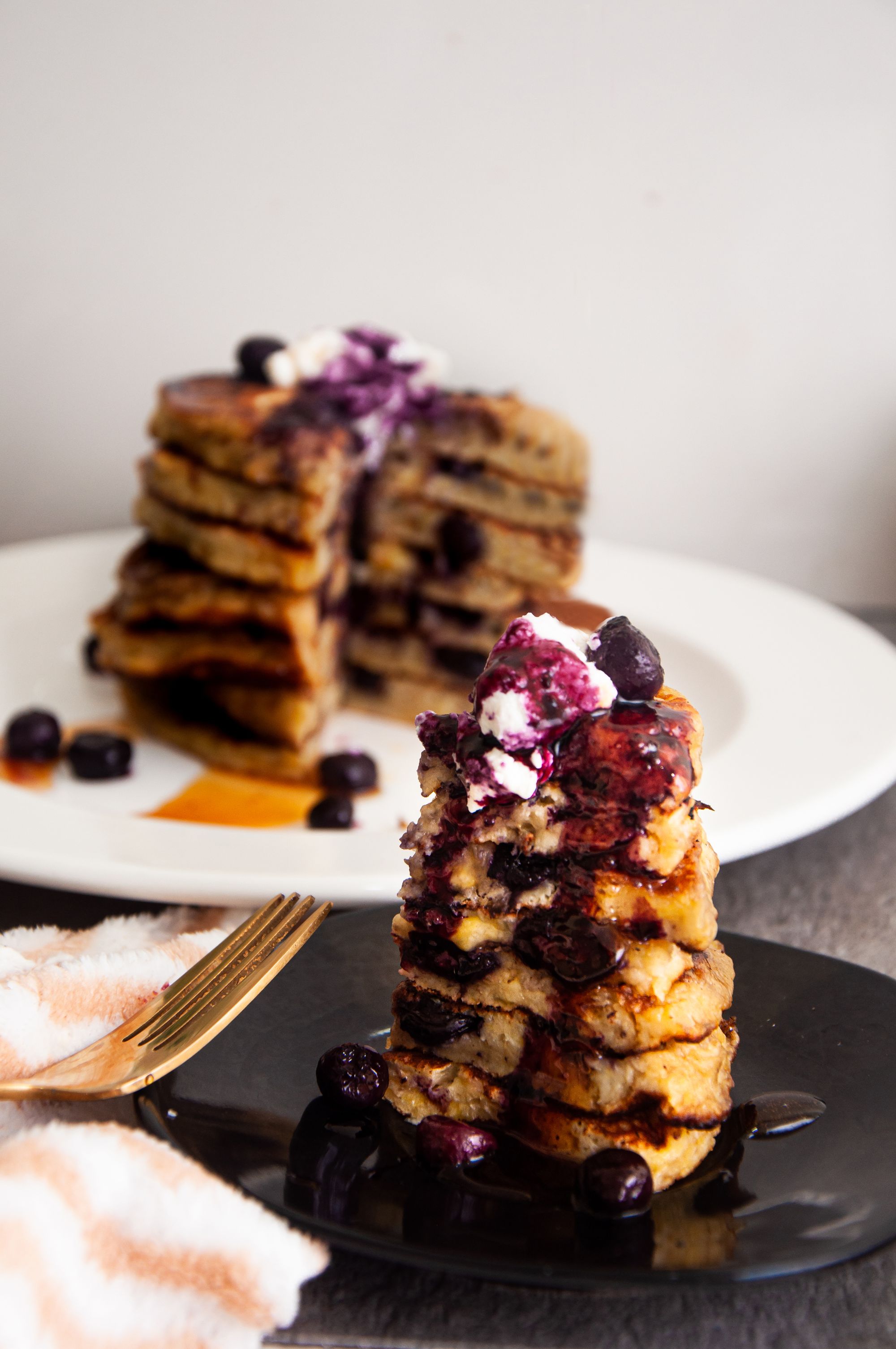 A bite of Banana and Blueberry Pancakes